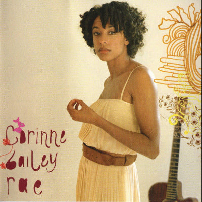 Album cover with a woman in a beige dress holding a guitar, featuring the name 'Corinne Bailey Rae'.