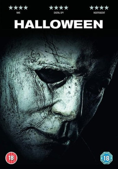 Movie poster for 'Halloween' featuring a close-up of a masked character's face.