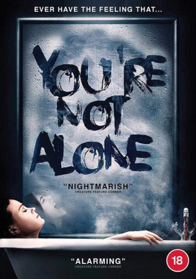 Movie poster with text 'You're Not Alone' and a woman in a bathtub.
