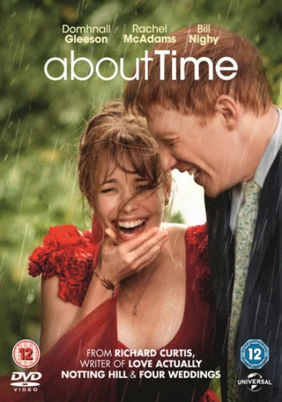 Movie poster for 'About Time' featuring a couple in a rainstorm.