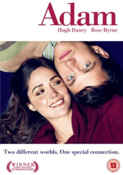 Movie poster featuring a couple with text about the film 'Adam'.