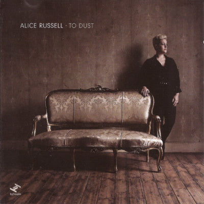 Album cover with a woman standing next to an ornate couch, featuring the text 'Alice Russell - To Dust'.