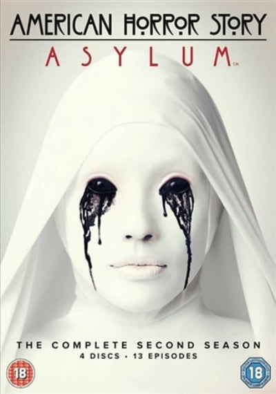 American Horror Story Asylum DVD cover with a person in white robes and black eye makeup.