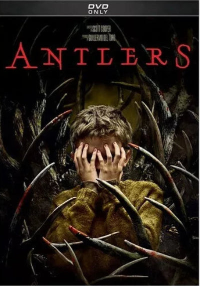 DVD cover of 'Antlers' with a person holding antlers over their face against a dark background.