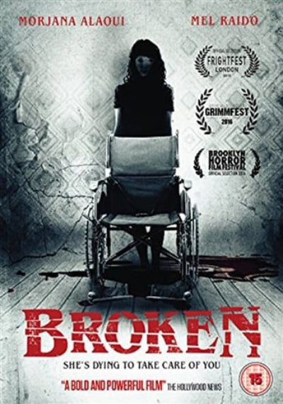 Movie poster for 'Broken' featuring a person in a wheelchair against a textured wall.