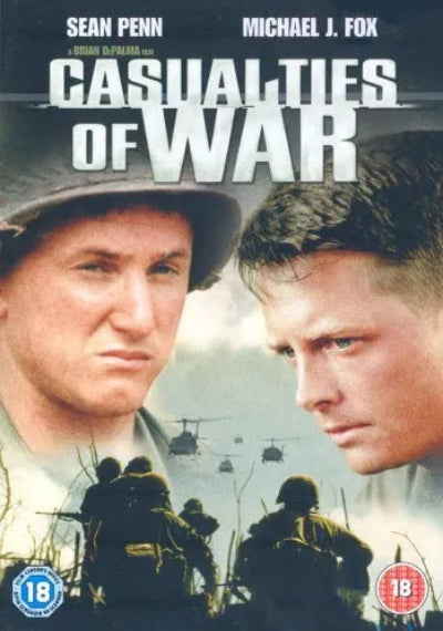 Movie poster for 'Casualties of War' featuring two men facing each other with soldiers and helicopters in the background.