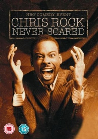 Promotional poster for 'Never Scared' featuring Chris Rock with a dark brown background.