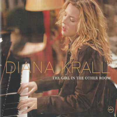 Album cover featuring a woman playing piano with text 'Diana Krall The Girl in the Other Room'.
