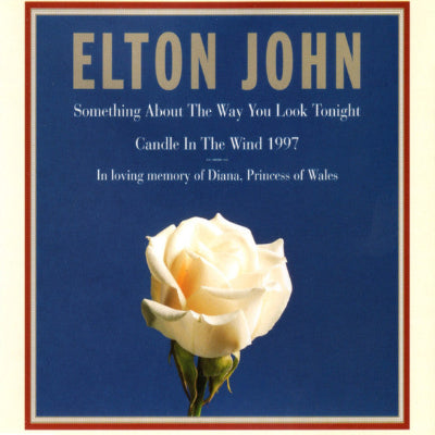 Album cover with a white rose on a blue background, featuring Elton John's 'Candle in the Wind' song.