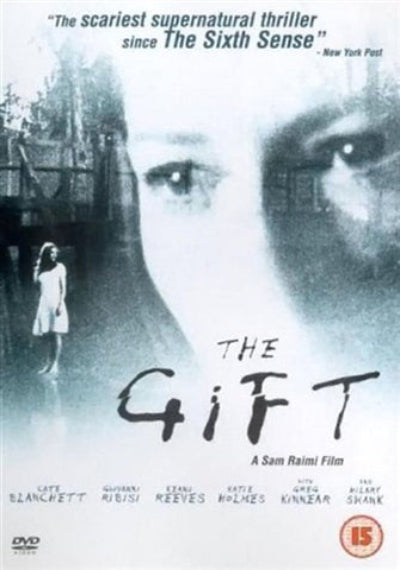 Movie poster for 'The Gift' featuring a woman and a ghostly figure.