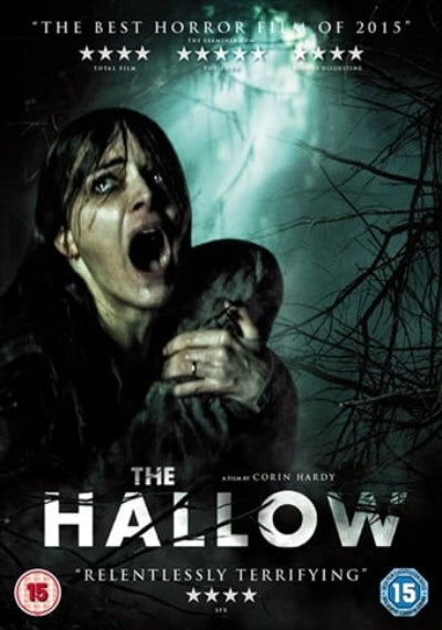 Movie poster for 'The Hallow' featuring a person with a gun in a dark, eerie setting.