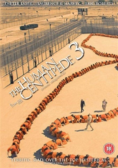 DVD cover of 'The Human Centipede 3' with a line of people in orange jumpsuits on sand.