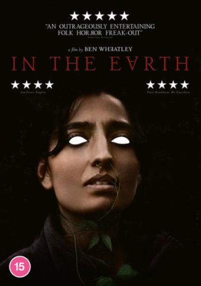Movie poster for 'In the Earth' with a woman's face and critical acclaim text.