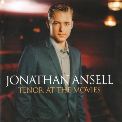 Album cover featuring a man in a suit with text 'Jonathan Ansell: Tenor at the Movies' against a blurred background.