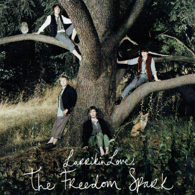Album cover with people sitting in a tree and animals, featuring the text 'Love is Love The Freedom Spark'.