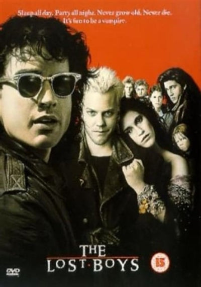Movie poster for 'The Lost Boys' featuring characters against a red background.