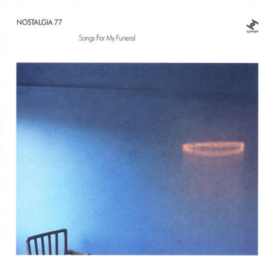 Album cover with a blue gradient and a chair, featuring the text 'Nostalgia 77' and 'Songs For My Funeral'.