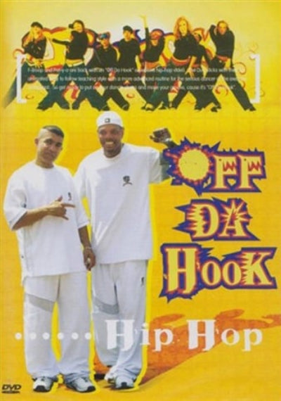 Two men in white clothing standing in front of a promotional poster for 'Off Da Hook Hip Hop' with a yellow background.