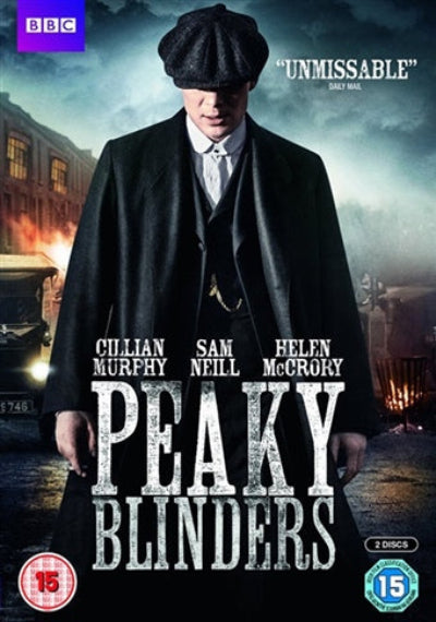 DVD for 'Peaky Blinders' with a character in a coat and hat, set against an urban background. New DVD.