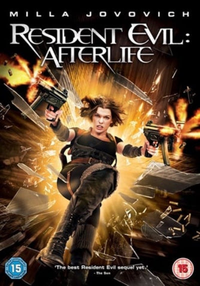 Resident Evil: Afterlife movie poster featuring Milla Jovovich in a black tactical outfit, holding two pistols amidst explosions, glass shards, and fiery action. The title 'Resident Evil: Afterlife' is displayed prominently at the top, with a 15 age rating logo in the bottom corners.