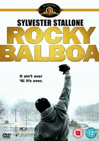 Rocky Balboa DVD cover featuring Sylvester Stallone raising his fist in a snowy outdoor scene, with large gold title text and a DVD logo at the bottom.