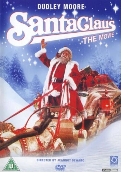 DVD cover for Dudley Moore's Santa Claus: The Movie, featuring Santa Claus waving from his sleigh in a snowy night scene. The title 'Santa Claus' is displayed in large white letters at the top, with 'The Movie' and Dudley Moore's name above it.