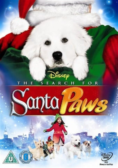 Disney's 'The Search for Santa Paws' DVD cover featuring a white dog puppy in a Santa hat and green blanket, with the title 'Santa Paws' in large gold and red letters over a snowy city skyline and a woman with several dogs.