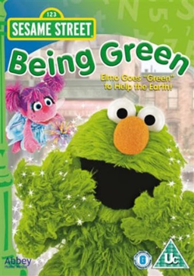 Sesame Street DVD cover for 'Being Green' featuring Elmo in a green costume, with Abby Cadabby on the left and the Sesame Street logo at the top.