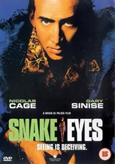 DVD cover for the film 'Snake Eyes' starring Nicolas Cage and Gary Sinise, featuring a close-up portrait of Nicolas Cage against a dark blue textured background with the title in large green and white text.