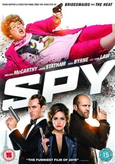 Movie poster for the film 'SPY' featuring Melissa McCarthy in a bright pink outfit lying on top, with Jason Statham, Rose Byrne, and Jason Lee below, all holding guns. Large white 'SPY' title text dominates the center, with film text and age rating badges around the edges.
