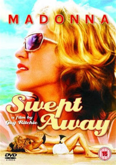 DVD cover for Madonna's film 'Swept Away', featuring a beach scene with Madonna in sunglasses, large red 'MADONNA' text at the top, and the film title in large yellow script.
