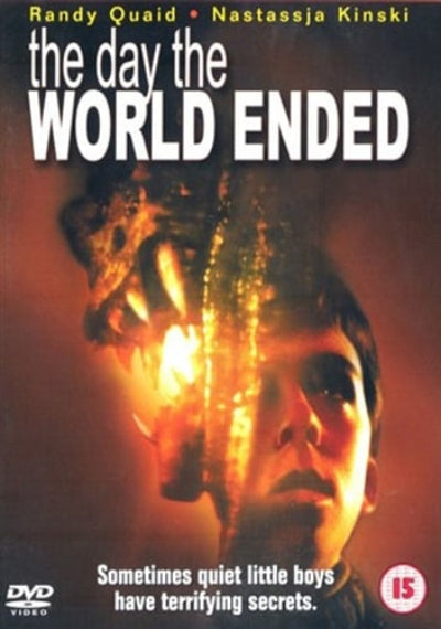 Movie poster for 'The Day the World Ended' with a boy's face and explosion.