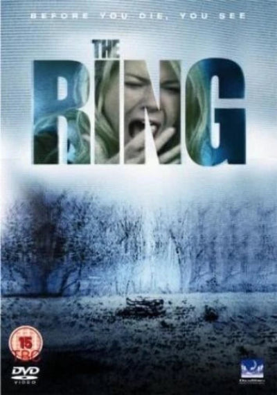 The Ring DVD cover featuring a chilling blue-toned forest scene with the title 'THE RING' in large letters filled with a screaming woman's face. A small haunted-house silhouette sits in the snowy ground foreground, with a DVD Video logo in the bottom left.