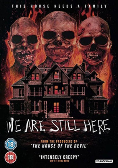 3 Skulls behind a burning house