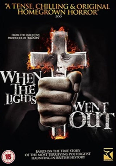 Movie poster for 'When the Lights Went Out' with a hand holding a cross on fire.